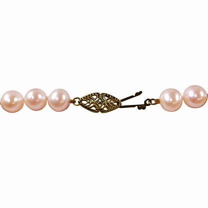 Strand of Pale Pink Pearls w. 14Kt Gold Clasp