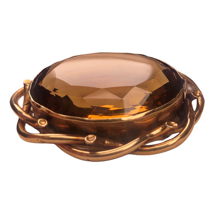 Very Substantial Faceted Oval Cut Citrine Mounted as a Brooch in a Gold Tone Frame