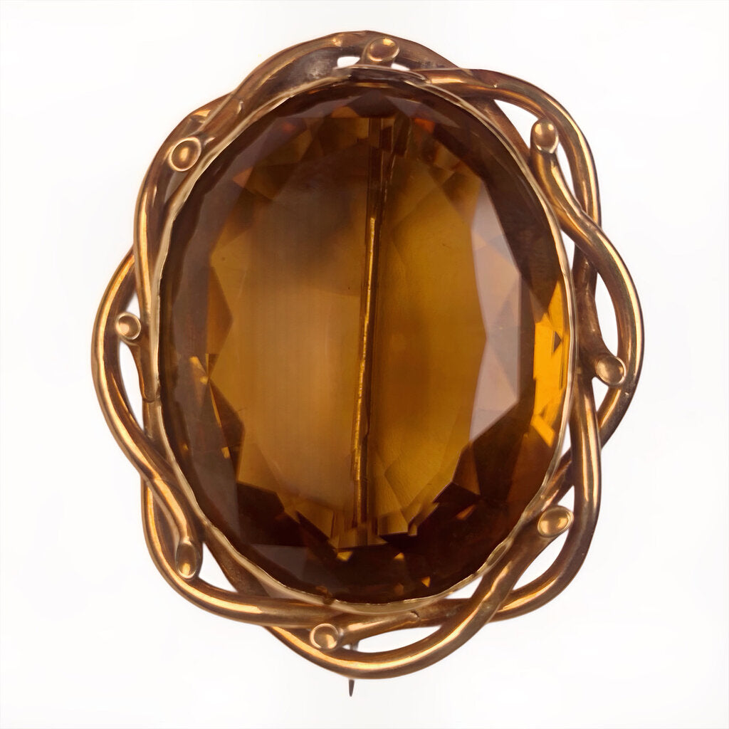 Very Substantial Faceted Oval Cut Citrine Mounted as a Brooch in a Gold Tone Frame