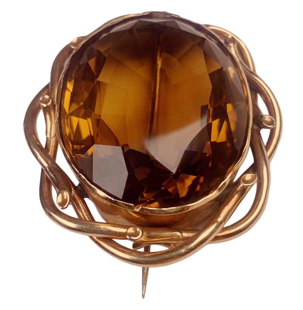 Very Substantial Faceted Oval Cut Citrine Mounted as a Brooch in a Gold Tone Frame